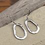 Organic Oval Hand Forged Sterling Silver Drop Earrings, thumbnail 1 of 4