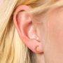 Tiny Crescent Moon Stud Earrings In Gold, thumbnail 1 of 3
