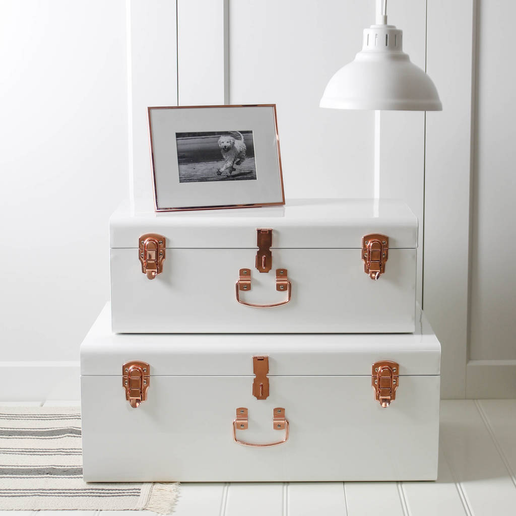two white and copper storage trunks by marquis & dawe