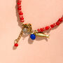 Red Candy Stripe Bead And Fish Charm Bracelet, thumbnail 4 of 5