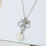 Crystal Bow And White Pearl Pendant Necklace Christmas Gift For Her, thumbnail 1 of 3