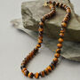 Mens Tigers Eye Chunky Crystal And Brass Necklace, thumbnail 1 of 3