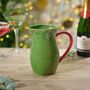 Christmas Holly Embossed Stoneware Jug With Red Handle, thumbnail 1 of 2