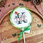 Personalised Christmas Initial Table Favour Lollipop, thumbnail 1 of 3