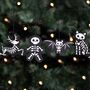 Set Of Four Black Creepy Skeleton Cookie Ornaments, thumbnail 1 of 3