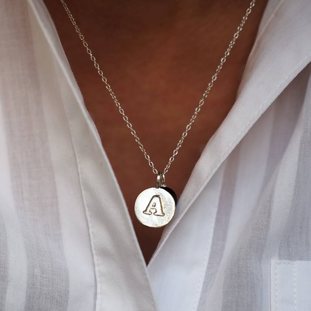 handmade silver embossed letter necklace by gracie collins