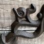 Ozzy Octopus Wall Mounted Cast Iron Loo Roll Holder, thumbnail 3 of 7