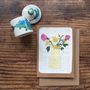 Daffodils And Roses On Vintage Book Paper Greeting Card, thumbnail 1 of 2