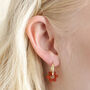 Brick Red Resin Flower Huggie Hoop Earrings In Gold, thumbnail 1 of 4