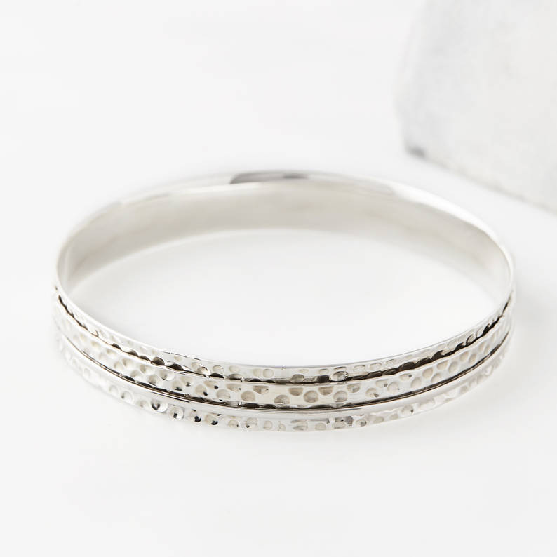 karma abundance silver spinning bangle by charlotte's web jewellery ...