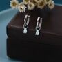 Sterling Silver White Opal Droplet Huggie Hoop Earrings, thumbnail 1 of 10