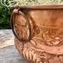 A Floral Embossed Vintage Style Copper Planter With Brass Ring Handles, thumbnail 5 of 11