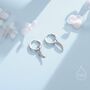 Sterling Silver Tiny Angel Wing Huggie Hoop Earrings, thumbnail 1 of 10