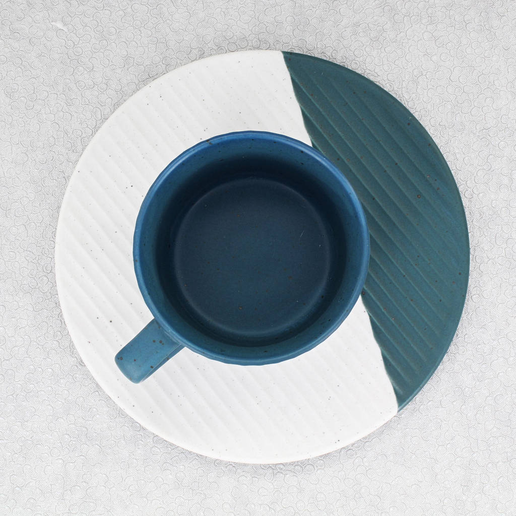 blue and white matching cup and saucer by g decor