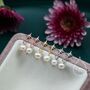Tiny Starburst And Dangle Pearl Stud Earrings, thumbnail 1 of 11