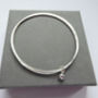 Delicate Double Silver Bangle With Silver Bead, thumbnail 3 of 4