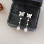 Kayla Ivory Silver Butterfly Charm Pearl Drop Earrings, thumbnail 1 of 6