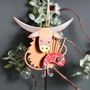 Christmas Highland Cow Coo With Bagpipes Hanging Decoration, thumbnail 1 of 3