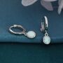 Sterling Silver Dangling Oval Opal Hoop Earrings, thumbnail 1 of 10