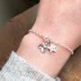 Personalised Well Done Exam Graduation Sterling Silver Small Holly Initial Star Bracelet, thumbnail 1 of 9