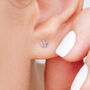 Tiny Sterling Silver Star Stud Earrings, thumbnail 2 of 8