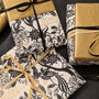Christmas Botanical Luxe Gift Wrap Black Gold And Ivory, thumbnail 1 of 12