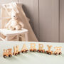 Personalised Christening Wooden Name Train, thumbnail 1 of 12