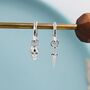 Mismatched Skull And Sword Huggie Hoop Earrings In Sterling Silver, thumbnail 1 of 11