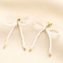 Stainless Steel Pearl Bow Stud Earrings In Gold, thumbnail 2 of 3