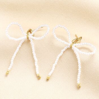 Stainless Steel Pearl Bow Stud Earrings In Gold, 2 of 3