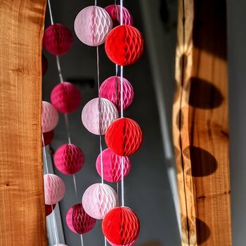 Honeycomb Paper Ball Garland Pinks And Red, 2 of 8