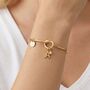 Gold Initial And Birthstone Adjustable Knotted Bangle, thumbnail 1 of 7