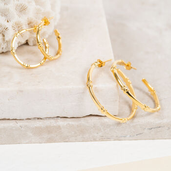 kiss up yellow hoop earrings