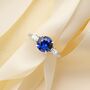 Blue Sapphire Round Cut Three Stone Engagement Ring In Sterling Silver And Gold, thumbnail 1 of 12
