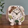 Ceramic Clock With Jumping Dogs In Chocolate Brown And Cream Yellow, thumbnail 1 of 8