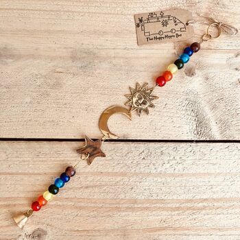 Recycled Brass Sun Moon And Star Chakra Hanging Bell, 2 of 8