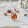 Modern Spiral Silver And Cognac Baltic Amber Pendant, thumbnail 1 of 3