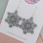 Silver Large Snowflake Glitter Christmas Earrings, thumbnail 3 of 5