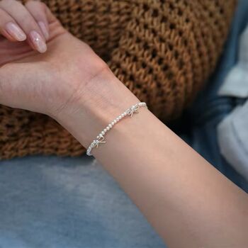 Saskia Ivory Silver Pearl Ribbon Ball Charm Gift Bracelet, 4 of 6