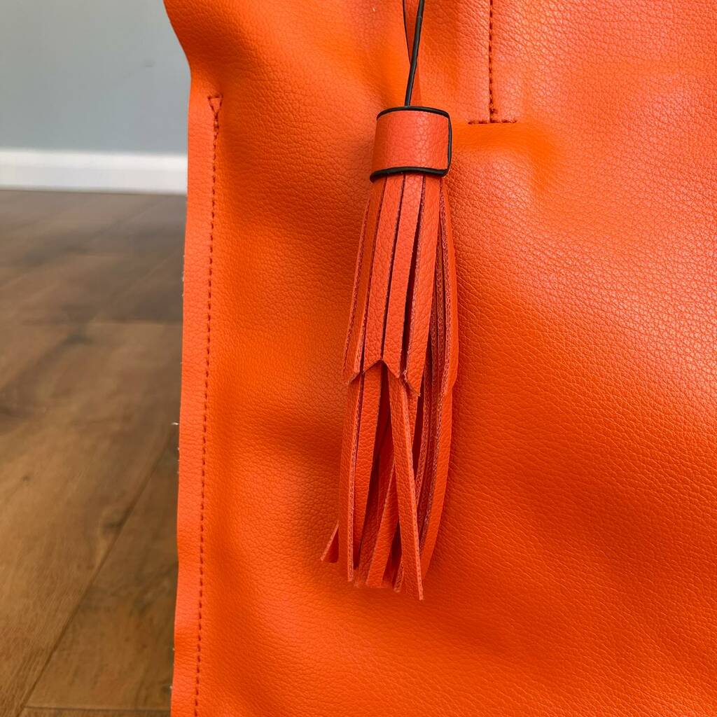 orange tassel bag