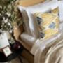 Square Ikat Silk Cushion Yellow And Blue Feather, thumbnail 1 of 8