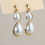Gold Teardrop Pearl Dangle Clip On Earrings, thumbnail 1 of 3