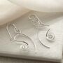 Sterling Silver Twirling Ribbon Dangly Earrings, thumbnail 1 of 4