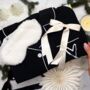 Luxury Christmas Pyjama Gift Set For Her With Eye Mask And Satin Hair Bow In Black And White, thumbnail 1 of 11