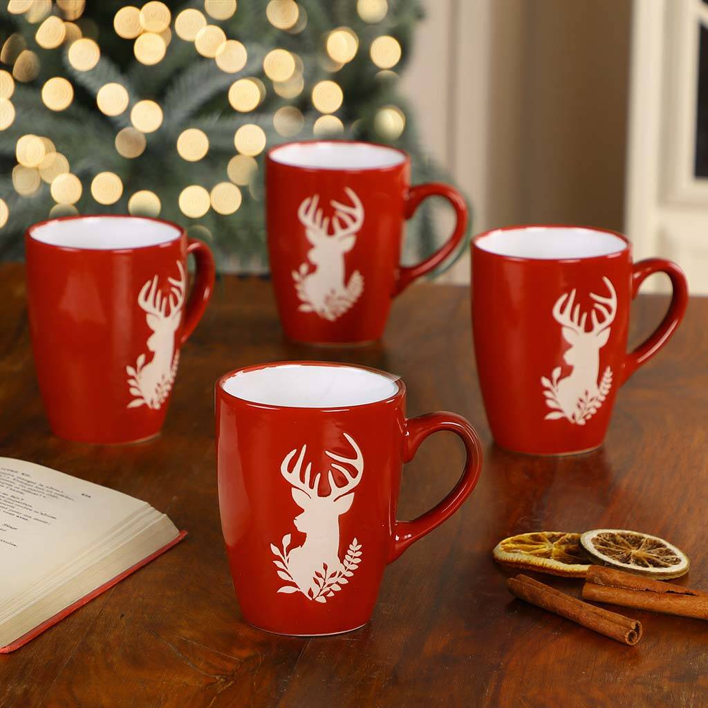 Set Of Four Cosy Christmas Ceramic Mugs By Dibor  notonthehighstreet.com