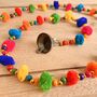 String Of Rainbow Pom Pom's With Brass Bell, thumbnail 5 of 5