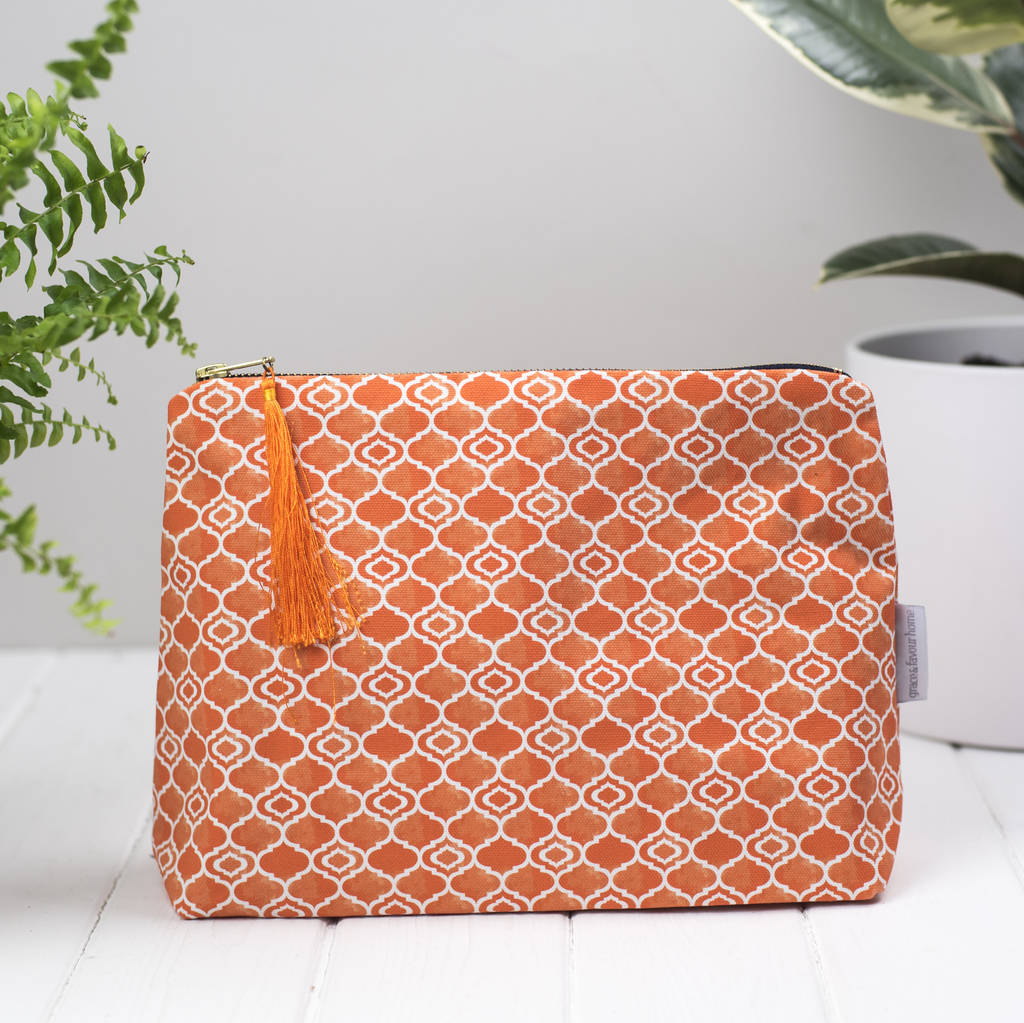 alta toiletry bag, geometric orange wash bag by grace & favour home