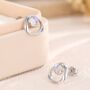 Sterling Silver Simulated Moonstone And Mobius Circle Stud Earrings, thumbnail 1 of 11
