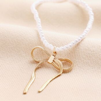 Pearl Necklace With Large Bow Pendant In Gold, 2 of 4