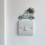 Blue Car Carrying A Christmas Tree Light Decoration, thumbnail 2 of 2